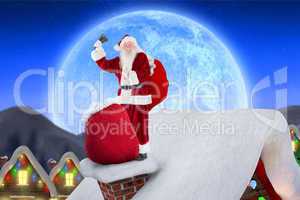 Composite image of santa on cottage roof