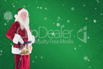 Composite image of father christmas is wearing a tool belt