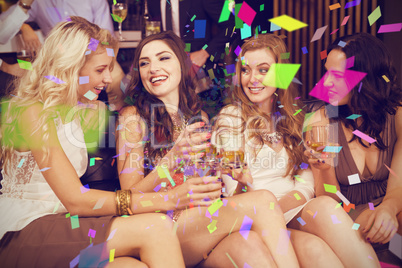 Composite image of pretty friends having a drink together