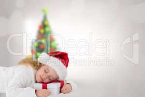 Composite image of cute girl with gift