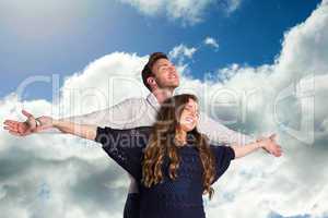 Composite image of romantic young couple with arms out