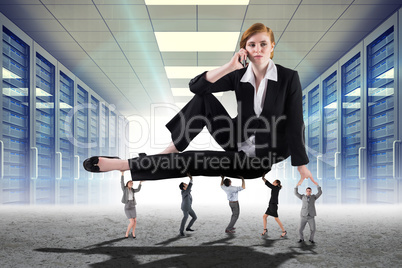 Composite image of business people supporting boss