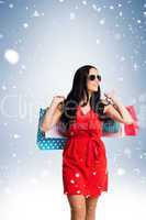 Woman standing with shopping bags