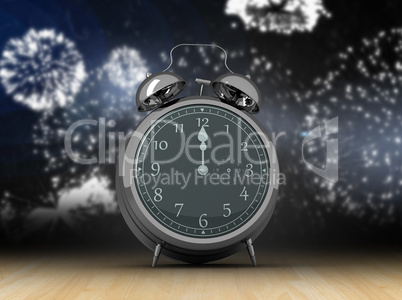 Composite image of alarm clock counting down to twelve