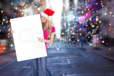 Festive blonde holding large poster