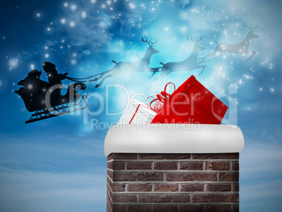 Composite image of santa flying his sleigh