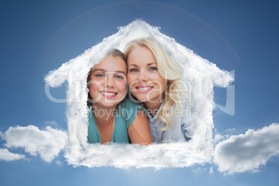 Composite image of portrait of a girl and her parents lying on a