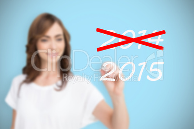 Composite image of smiling businesswoman holding marker