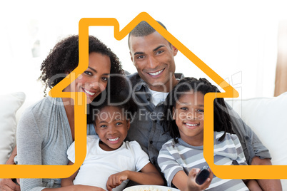 Composite image of family watching television at home