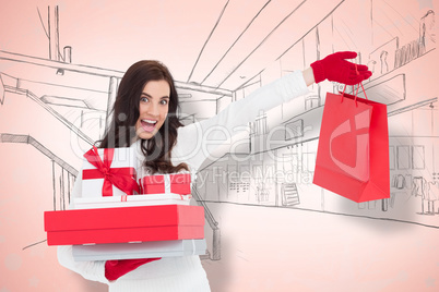 Composite image of excited brunette holding gifts and showing sh