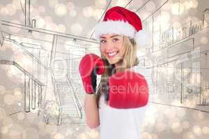 Composite image of festive blonde punching with boxing gloves