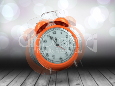 Composite image of alarm clock counting down to twelve