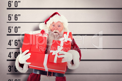 Composite image of santa carries a few presents