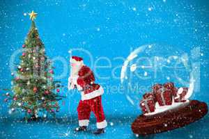 Composite image of santa pulling snow globe of presents