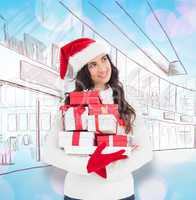 Composite image of joyful brunette in santa hat and red gloves h