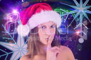 Composite image of festive brunette keeping a secret