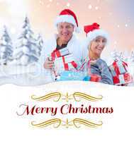 Composite image of couple with shopping bags and gifts