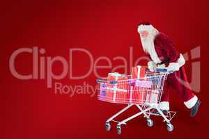 Composite image of santa rides on a shopping cart