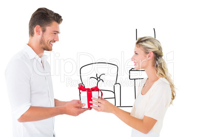 Composite image of young couple with gift