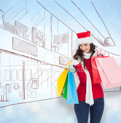 Composite image of smiling brunette in winter wear holding shopp