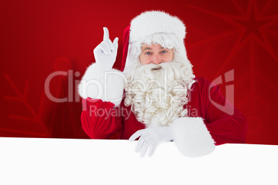 Composite image of smiling santa claus doing a gesture