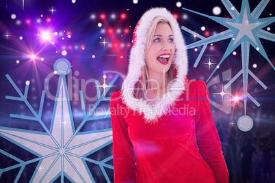 Composite image of festive blonde looking to the side