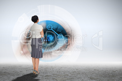 Composite image of businesswoman standing