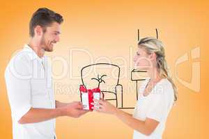 Composite image of young couple with gift