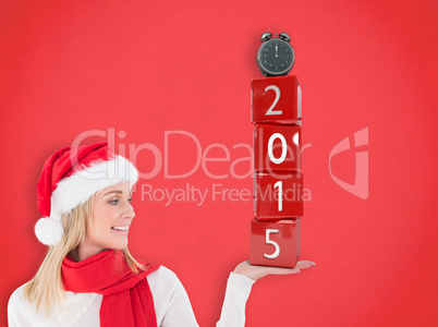 Composite image of festive blonde holding hand out