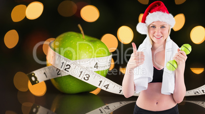 Composite image of festive fit blonde smiling at camera