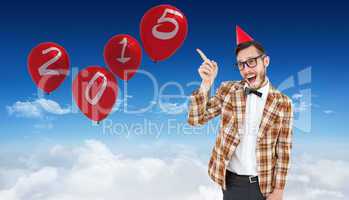 Composite image of geeky hipster in party hat pointing