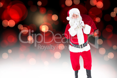 Composite image of santa holding sack and keeping a secret