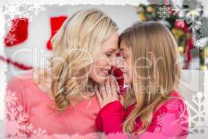 Composite image of festive mother and daughter smiling at each o