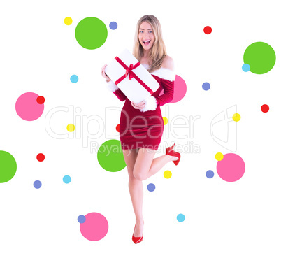 Composite image of pretty santa girl smiling at camera