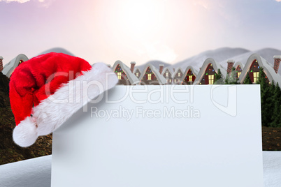 Composite image of santa hat on poster