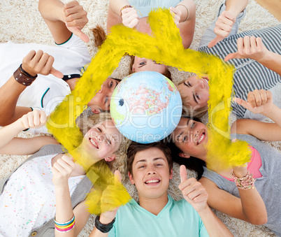 Composite image of teenagers on the floor with a terrestrial glo