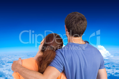 Composite image of couple with backs to camera