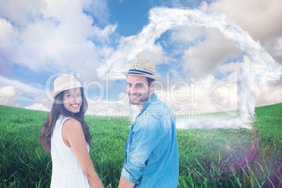 Composite image of happy hipster couple holding hands and smilin