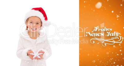 Composite image of festive little girl holding snowflake