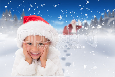 Composite image of cute little girl wearing santa hat