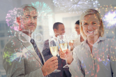 Composite image of business team celebrating with champagne and