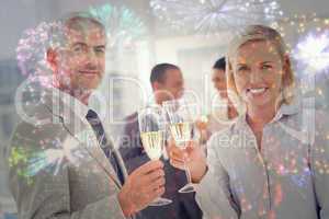 Composite image of business team celebrating with champagne and