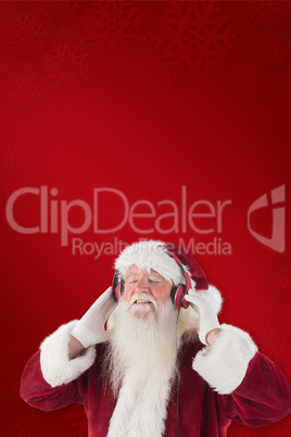 Composite image of santa claus enjoys some music