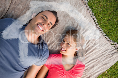 Composite image of two friends looking towards the sky while lyi