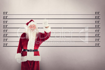 Composite image of jolly santa waving at camera