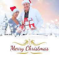 Composite image of festive mature couple holding christmas gifts