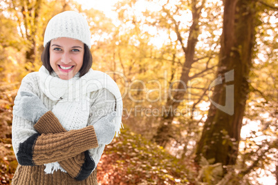 Composite image of brunette in warm clothing