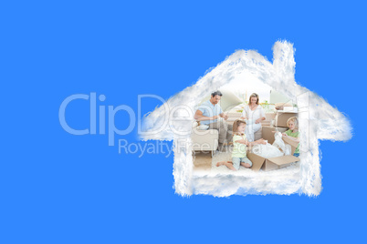 Composite image of family unpacking cardboard box