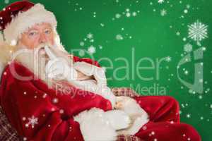 Composite image of santa asking for quiet