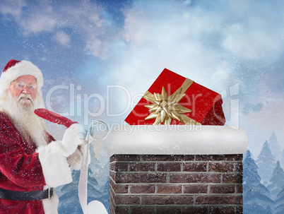 Composite image of santa writing his list